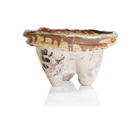 ▲ Simon Carroll (1964-2009), an earthenware slab basin, 2003, with a trailing glaze to the dished bowl, raised on three lug s