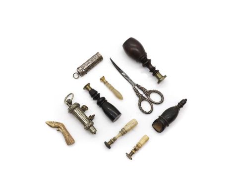 A collection of tampers and seals, comprising two bone tampers, one of simple turned form 5.5cm long, one example modelled as