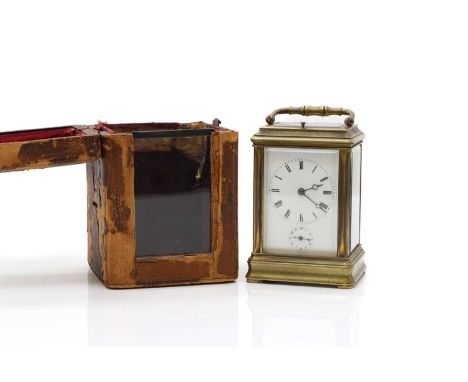 A brass gorge cased repeating carriage clock, with alarm, with an enamelled dial, with Roman numerals, with an Arabic alarm d