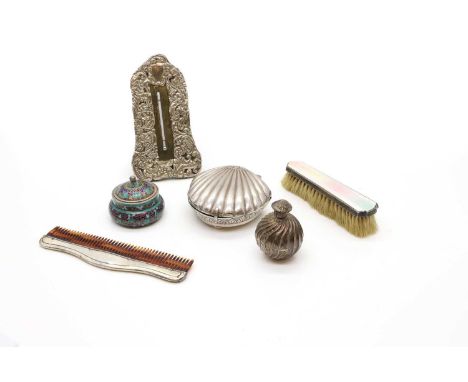 A group of silver dressing table items comprising an Indian shell form box, a Victorian perfume bottle, of spiral form, 7.5cm