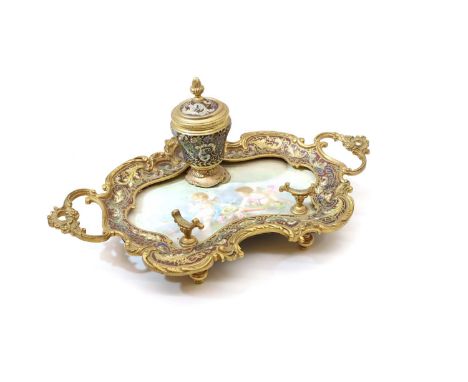 A French champleve and gilt bronze inkstand, 20th century, centred with a hinged inkwell, the shaped stand with integral hand