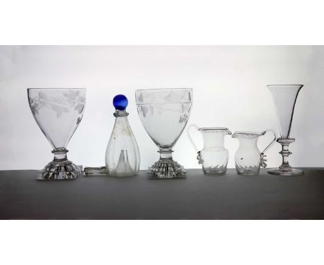 A group of glass items comprising two wruthen moulded cream jugs, 18th century, tallest 9.9cm, a pair of glass rummers, c.180