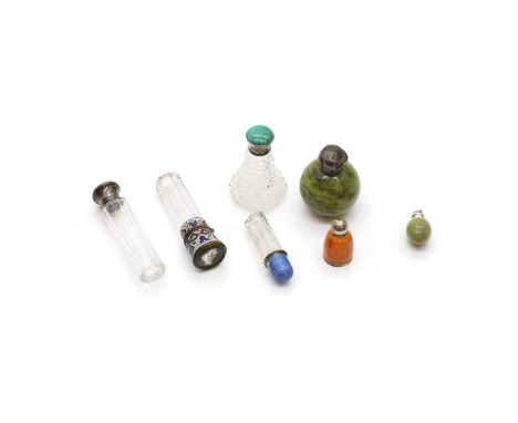 A group of scent bottles comprising a hardstone example, of globular form, with a silver top, 5.4cm high, a similar example, 