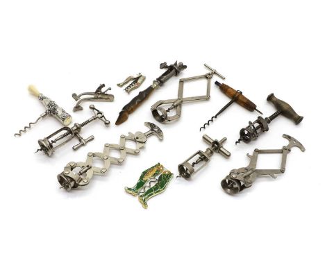 A collection of corkscrews comprising two examples formed as legs, largest 8.5cm, a 'Zig Zag ' example, 15.5cm long, a concer