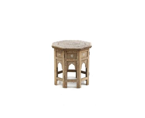 A Hoshiapur folding octagonal table, 20th century, Indian, with ivory inlaid decoration, 38cm wide40cm highIMPORTANT NOTE  Th
