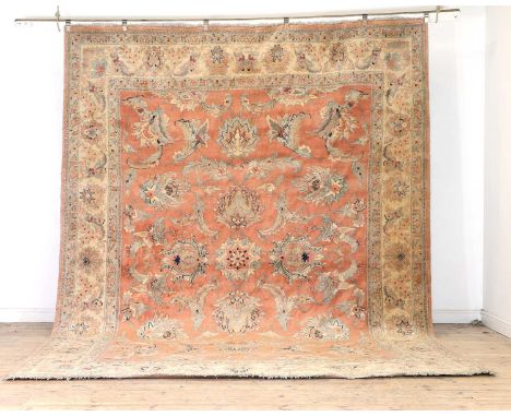 A Ziegler Mahal style carpet,  20th century, wool on a cotton foundation, the brick red field with large flowerheads and scro
