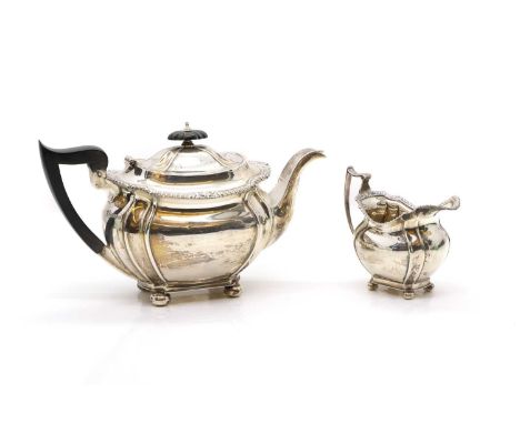 A silver part tea service comprising by John Round, Sheffield 1929, a teapot, 26cm wide, and cream jug, 10.5cm high,27.5ozt (