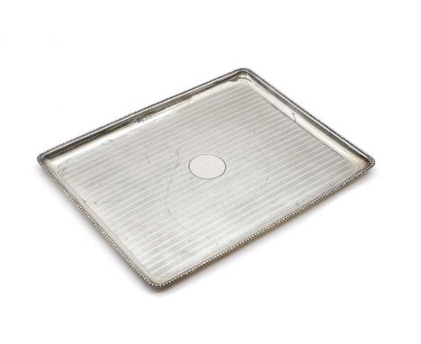 A silver tray by Walker &amp; Hall, Birmingham 1939, with engine-turned decoration to a vacant circular centre, 27.5cm wide13