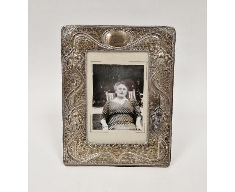Edwardian art nouveau silver easel photograph frame, decorated on a textured ground with stylised Iris, hallmarked Birmingham