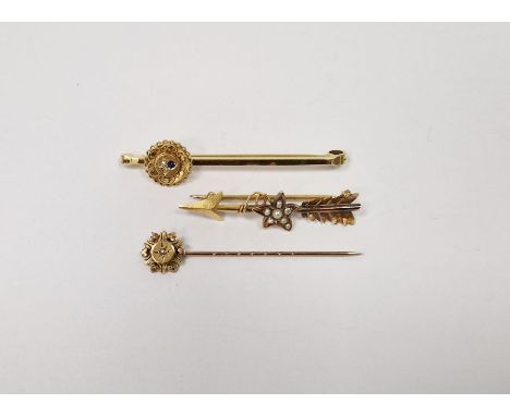 15ct gold and seed pearl arrow and star patterned bar brooch, 9ct gold diamond and sapphire bar brooch set circular medallion