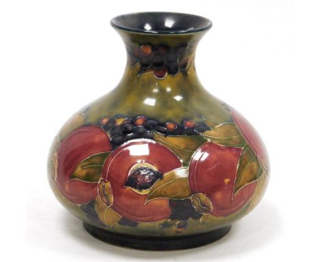 Moorcroft Pomegranate pattern globular vase, impressed marks and green signature to base, with flared neck, tubelined with se