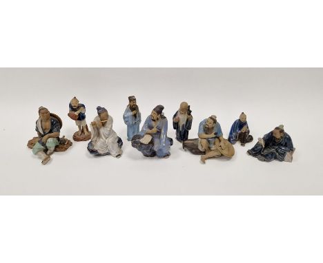 Nine Chinese Shiwan mudman-type figures of musicians, tradesmen, an immortal and others, various impressed marks, in sizes 12