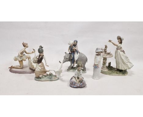 Six Lladro figures, printed and impressed marks, including: an Eastern couple riding an elephant, a girl beside a fountain, a