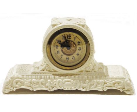 Cast brass winged female nude figure&nbsp;as a car mascot, in Art Deco-style, 17cm long,&nbsp;an embossed cream metal mantel 