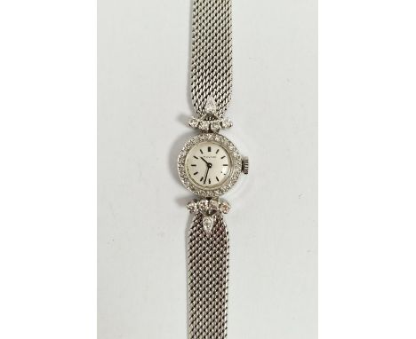 Mid-century lady's 9ct white gold and diamond set Movado cocktail wristwatch, the circular dial having black baton hour marke