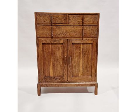 20th century oak cabinet having two short over one long drawer, over a further two-door cupboard, 107cm high x 76cm wide x 30