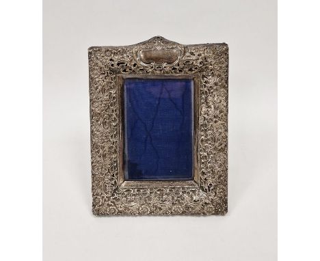Late Victorian silver photograph frame, with pierced rocaille&nbsp;and floral frame centred by a scroll cartouche, with bevel