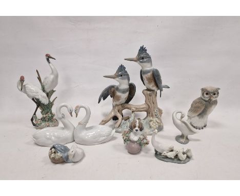 Group of eight Lladro and Nao figures, printed and impressed marks, including: a pair of swans in heart formation, two herons