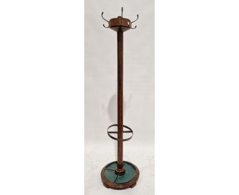 Early 20th century oak coat and umbrella stick stand of cylindrical form, 185cm high together with an oak standard lamp