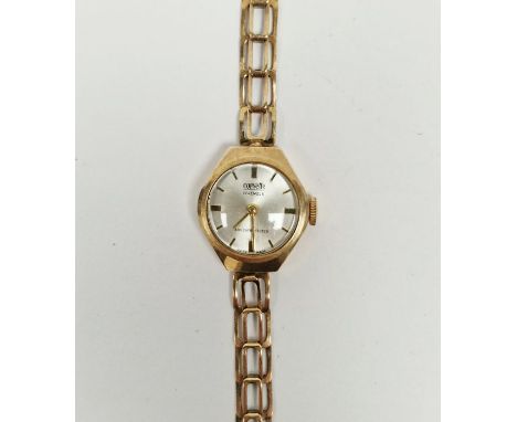 Lady's 9ct gold Corvette manual wind wristwatch, the silvered dial with raised gilt baton hour markers, 9ct gold case and bra