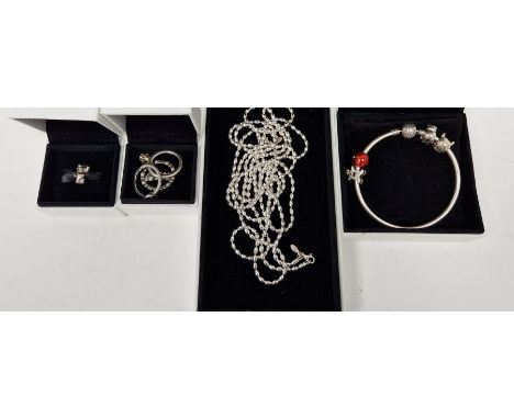 Five rings, probably Pandora, in Pandora box, a Pandora 'Pudsey' charm, a bangle bracelet, other charms&nbsp;and two silver c