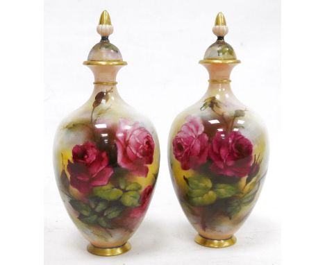 Pair of early 20th century Royal Worcester Hadley Ware oviform vases and covers, printed green marks, iron 294/15, each paint