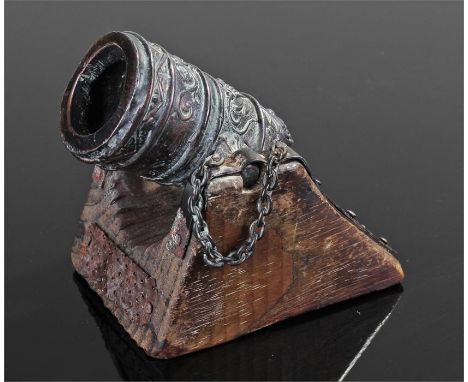 Miniature Mortero Campana canon, the swag designed canon raised on a shaped carriage, name plaque to the rear, 8cm long