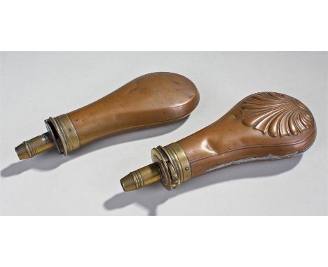 Two 19th Century powder flasks, the first by Dixon & Sons, with shell design, the second by Skyes, plain form, 20cm long, (2)