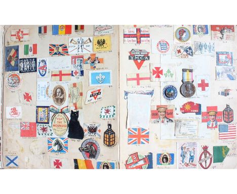 First World war scrap album, to include various printed regimental symbols, an RSPCA Fund for sick and wounded horses badge, 
