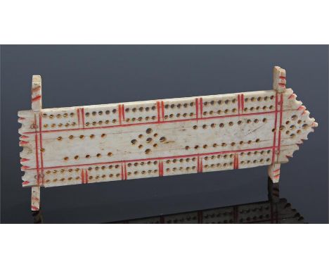 Napoleonic Prisoner of War cribbage board, with a series of holes on a shaped rectangular board, sledge supports, 13.5cm long