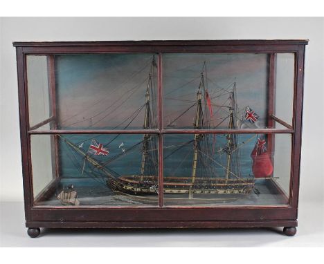 Early Victorian ship diorama, of HMS Queen, the ship at sea with 64 guns, figures on the deck, a smaller ship to the side, bo