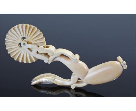 Mid 19th Century scrimshaw whale bone crimper, possibly Amercian, in the form of a ladies leg above the crimper wheel and a f