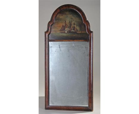 Naval interest, a 19th Century mirror, painted to the arch a pair of ships engaged in an attack, with mirror plate below and 