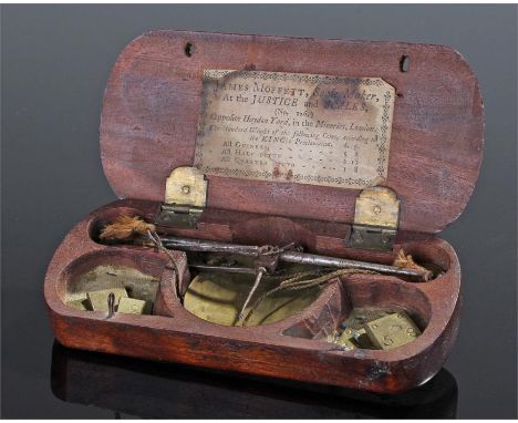 George III mahogany cased set of scales, maker James Moffett, the rectangular case with rounded ends, paper label to the inte