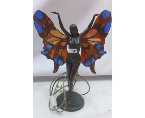 A Tiffany style table lamp, the spelter base modelled with female wearing multi-coloured lidded glass wings, H. 50cm 