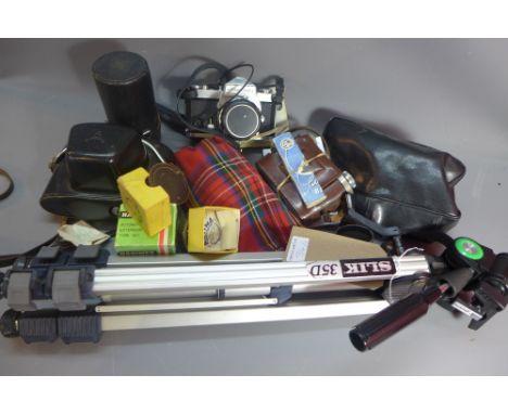 A collection of cameras, including a 1952 Balda Super Baldinette camera in case ,Nikon Nikormat with lens and a Tripod 