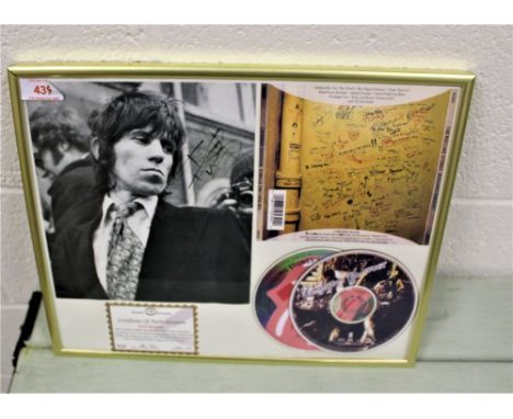 A framed and signed authenticated Keith Richards compact disc set and photo.
