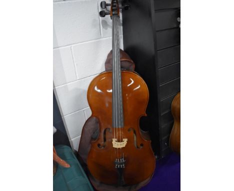 A traditional cello, labelled Rosetti (tatra) Stradivarius model