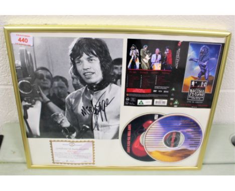A framed and signed authenticated Mick Jagger compact disc set and photo.
This is a hand signed