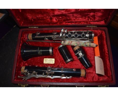 A 'Graduate' clarinet, made for Ruddal, Carte &amp; Co , in original burgundy case, with plush lining