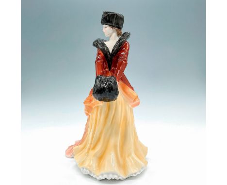 Fine bone china, premiere figure hand decorated in a brown Ombre overcoat with mink collar, hat, and muff; gold gilt accents.