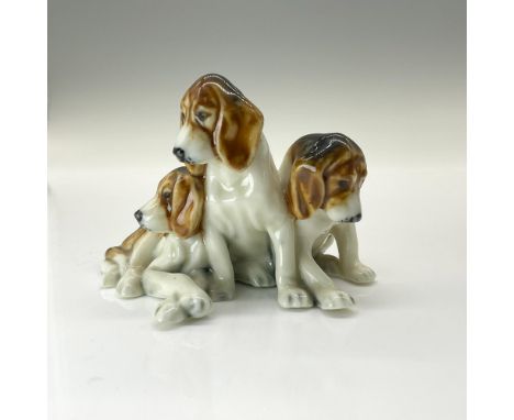 These adorable puppies modeled in black and brown markings on white. Part of the Royal Worcester Dogs series. Royal Worcester