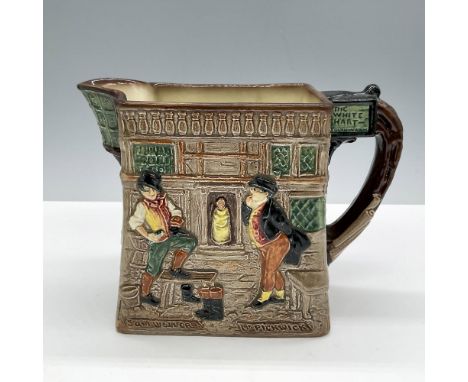 Glazed porcelain pitcher embossed with various characters from the novel The Pickwick Papers. Royal Doulton backstamp. Issued