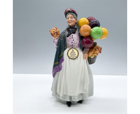 Glazed finish. Features a lovely balloon seller dressed in a white skirt, purple blouse and gray shawl. Royal Doulton backsta