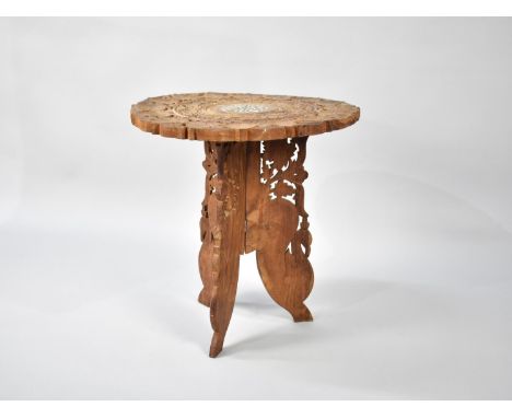 A Far Eastern Carved and Pierced Circular Table on Folding Tripod Stand, 45cms Diameter 