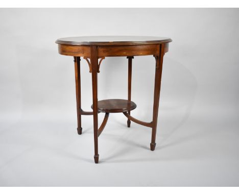 An Edwardian Mahogany Oval Topped Occasional Table on Tapering Square Supports, with Oval Stretcher Shelf, 77cms Wide 