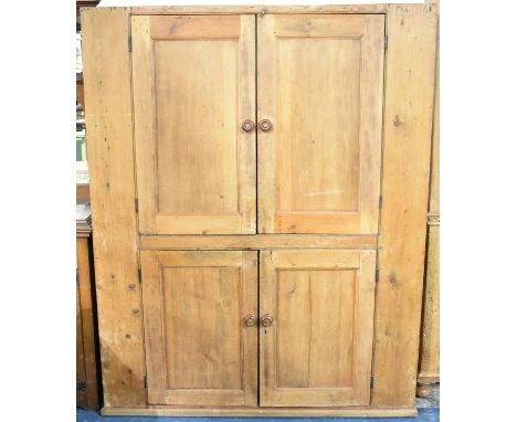 A 19th Century Stripped Pine Double Pantry Cupboard with panelled Doors to Upper and Lower Shelf Sections, 157cms by 58cms an