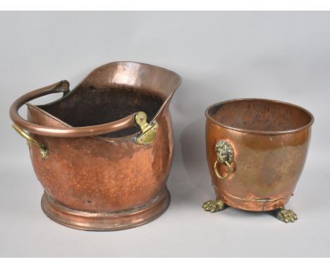 A Mid 20th Century Copper Helmet Shaped Coal Scuttle together with a Copper Planter having Brass Lion Mask Ring Handles and T