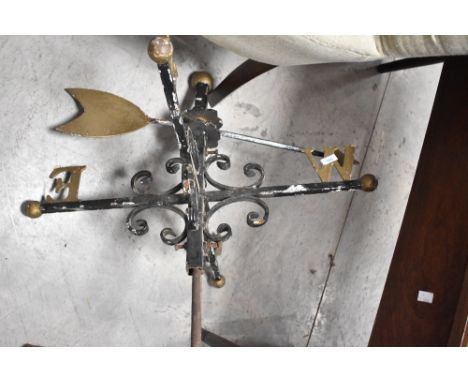 A traditional wrought iron weather vane