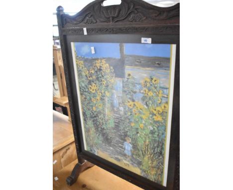 A 19th Century carved oak fire screen